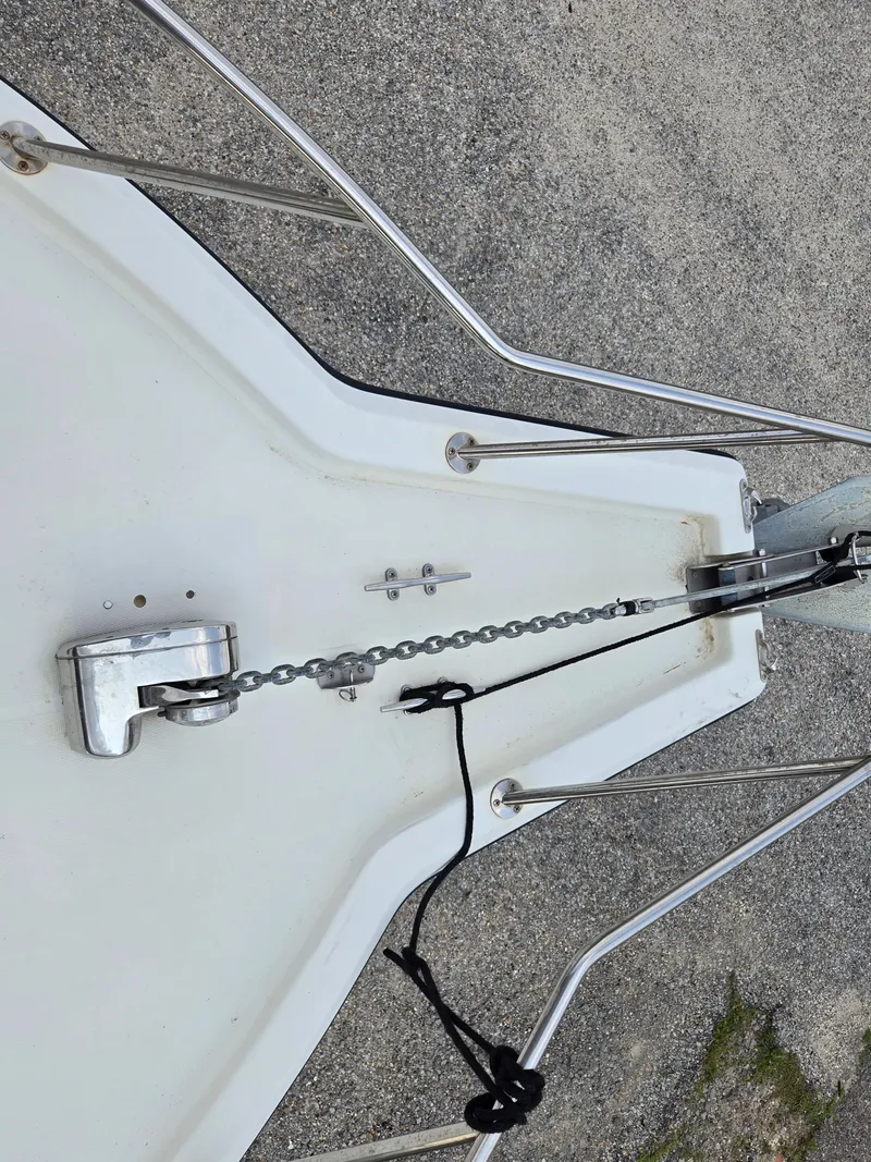 Slide: The Image of Bow of 1992 Stamas 288 Liberty boat with anchor chain and railing. - 26