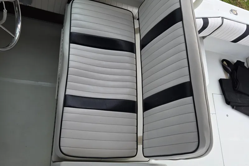 Slide: The Image of White and black striped seating on a 1992 Stamas 288 Liberty boat. - 28