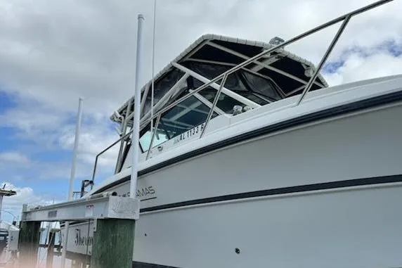Slide: The Image of 1992 Stamas 288 Liberty boat docked under cloudy sky. - 8