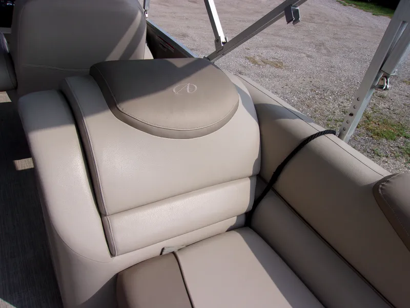 Slide: The Image of 2018 Avalon Catalina Cruise 23' boat interior seating with beige upholstery. - 12