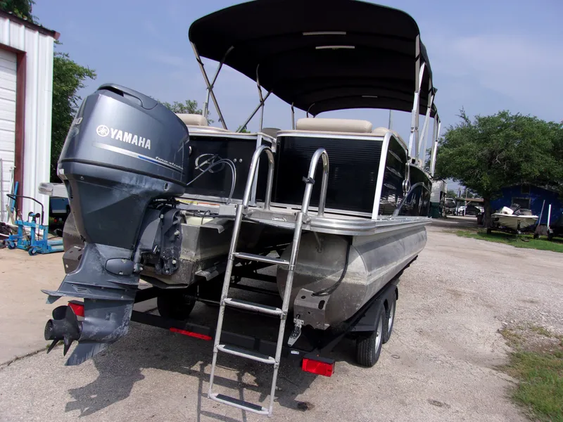 Slide: The Image of 2018 Avalon Catalina Cruise 23' pontoon boat with Yamaha outboard motor and ladder. - 4