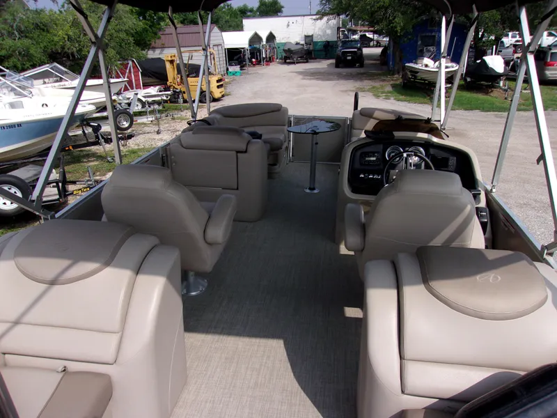 Slide: The Image of 2018 Avalon Catalina Cruise 23' pontoon boat with beige seating and spacious deck. - 5