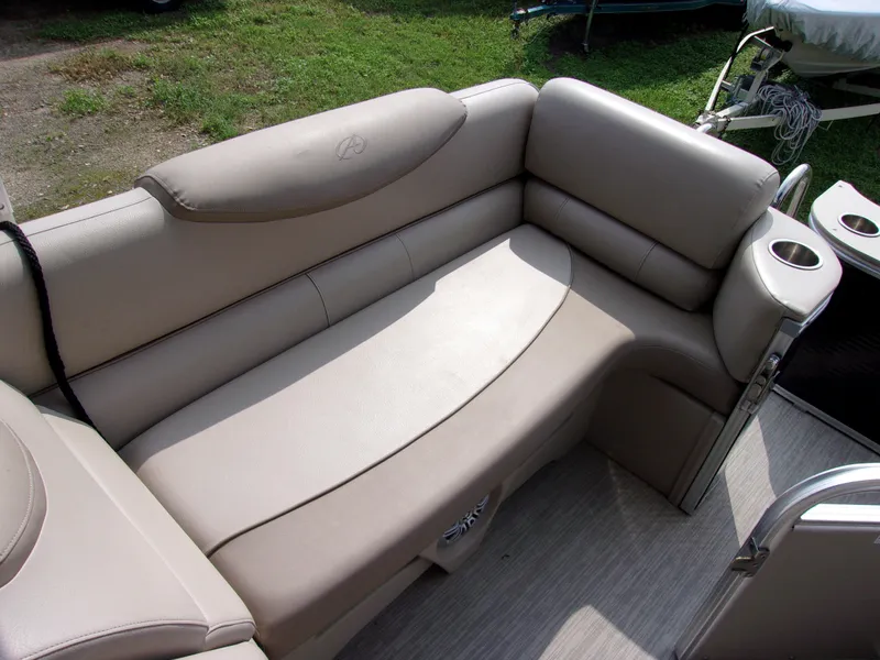 Slide: The Image of 2018 Avalon Catalina Cruise 23' boat with beige seating and cup holders. - 9