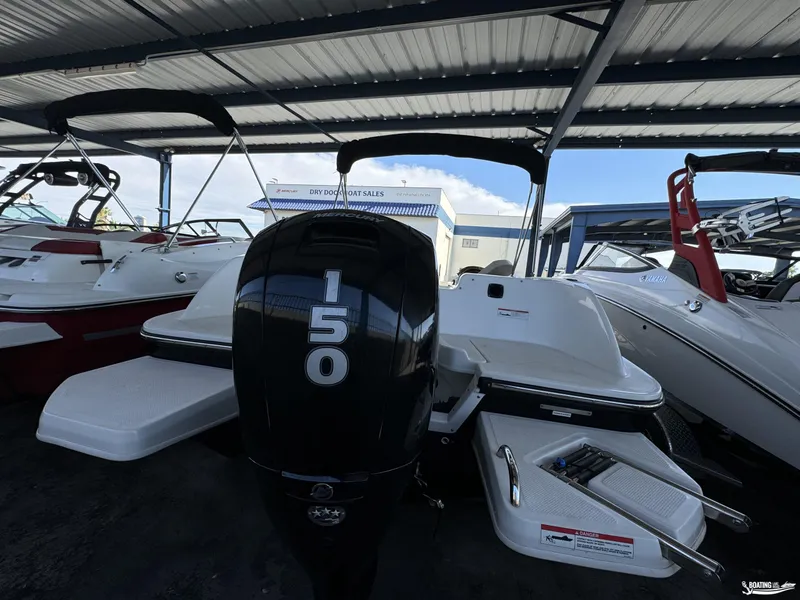 Slide: The Image of 2020 Bayliner E21 boat with 150 horsepower engine in showroom. - 9