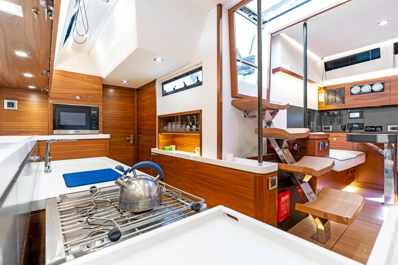Slide: The Image of Interior of Amel 50 yacht, modern kitchen and stairs, year 2019. - 10