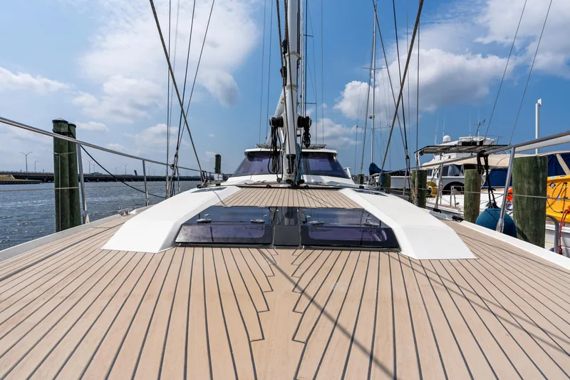 Slide: The Image of 2019 Amel 50 sailboat on water, blue sky. - 20