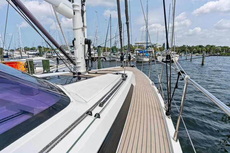 Slide: The Image of 2019 Amel 50 sailboat docked at marina. - 22