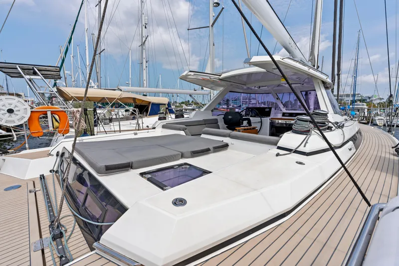 Slide: The Image of 2019 Amel 50 sailboat docked, featuring modern design. - 24