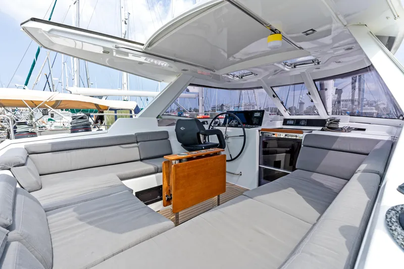 Slide: The Image of Interior of a 2019 Amel 50 yacht with gray seating. - 26