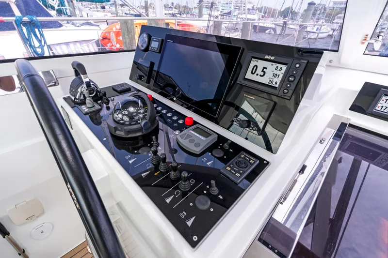 Slide: The Image of Amel 50 yacht helm station, 2019 model, featuring modern navigation technology. - 29