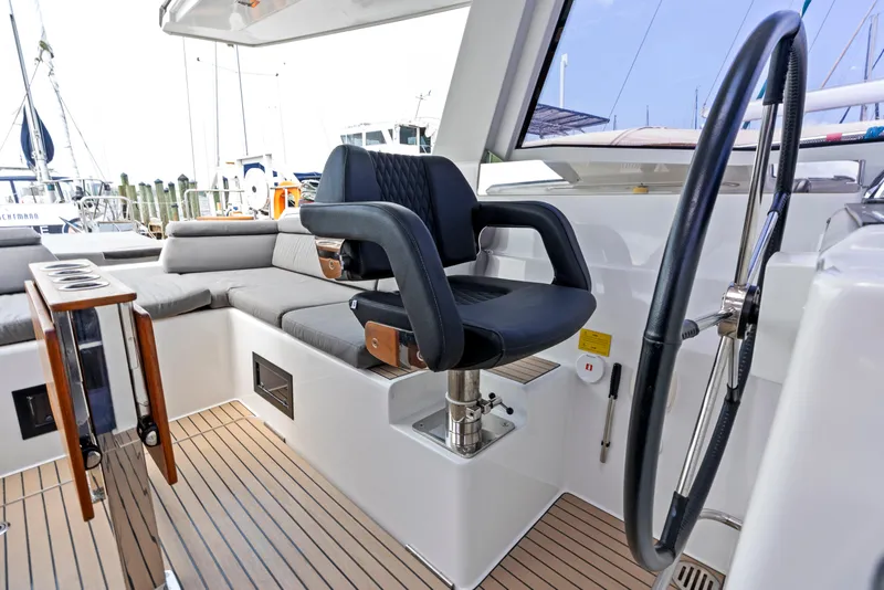 Slide: The Image of Amel 50 sailboat cockpit, 2019 model, featuring steering wheel and seat. - 30