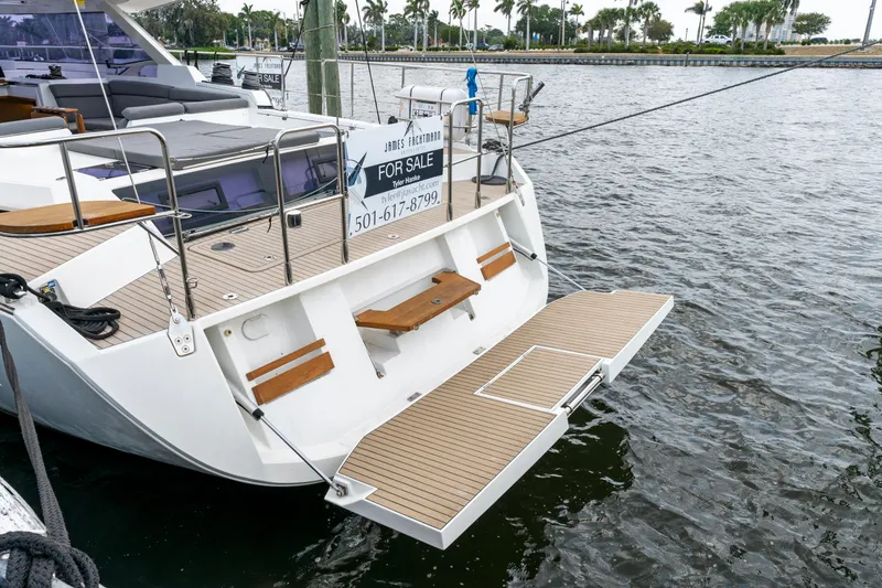 Slide: The Image of 2019 Amel 50 sailboat for sale, docked by the water. - 35