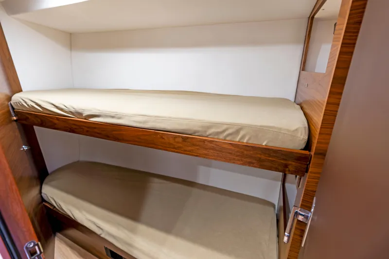 Slide: The Image of Bunk beds in the 2019 Amel 50 yacht cabin. - 5