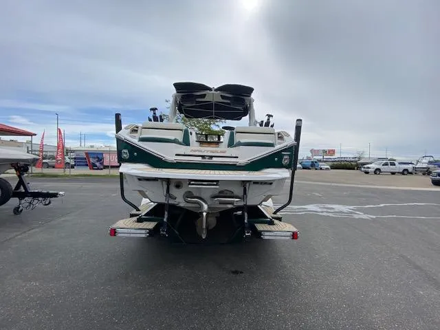 Slide: The Image of 2020 Nautique PARAGON 23 boat, rear view in a parking lot. - 4
