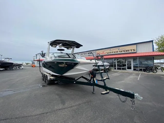 Slide: The Image of 2020 Nautique PARAGON 23 boat on trailer at dealership parking lot. - 9