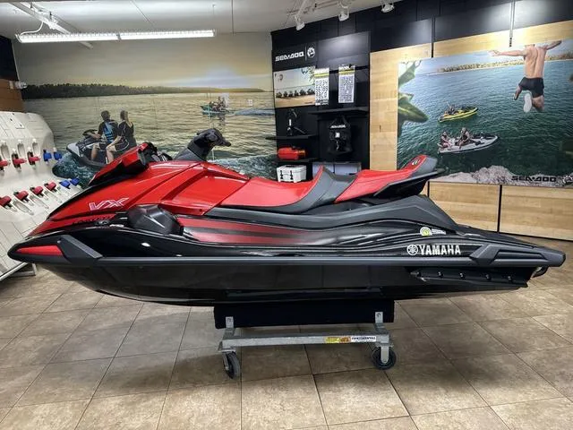Slide: The Image of 2024 Yamaha WaveRunner VX Limited in showroom, red and black design. - 7