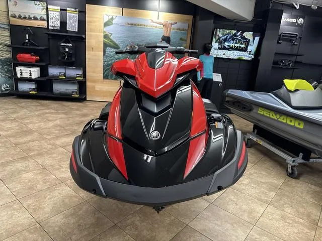 Slide: The Image of 2024 Yamaha WaveRunner VX Limited in showroom, red and black design. - 9