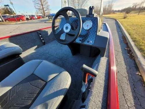 Slide: The Image of 2024 Tracker Bass Tracker Classic XL boat interior with steering wheel and dashboard. - 3