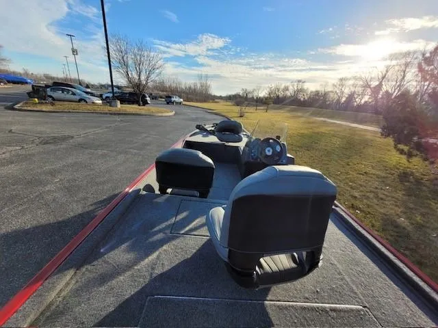 Slide: The Image of 2024 Tracker Bass Tracker Classic XL boat parked in a lot on a sunny day. - 4