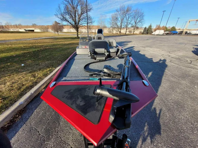 Slide: The Image of 2024 Tracker Bass Tracker Classic XL fishing boat in a parking lot. - 5