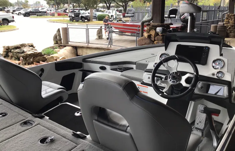 Slide: The Image of 2024 Nitro Z20 Pro boat interior with steering wheel and seating. - 1