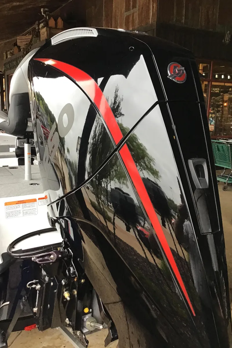 Slide: The Image of 2024 Nitro Z20 Pro boat engine with sleek black and red design. - 3