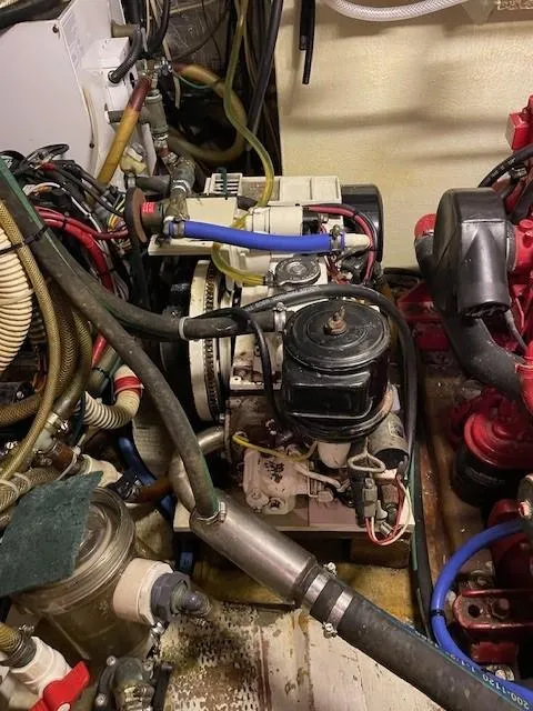 Slide: The Image of 1975 Allied Mistress engine room with various mechanical components and wiring. - 4