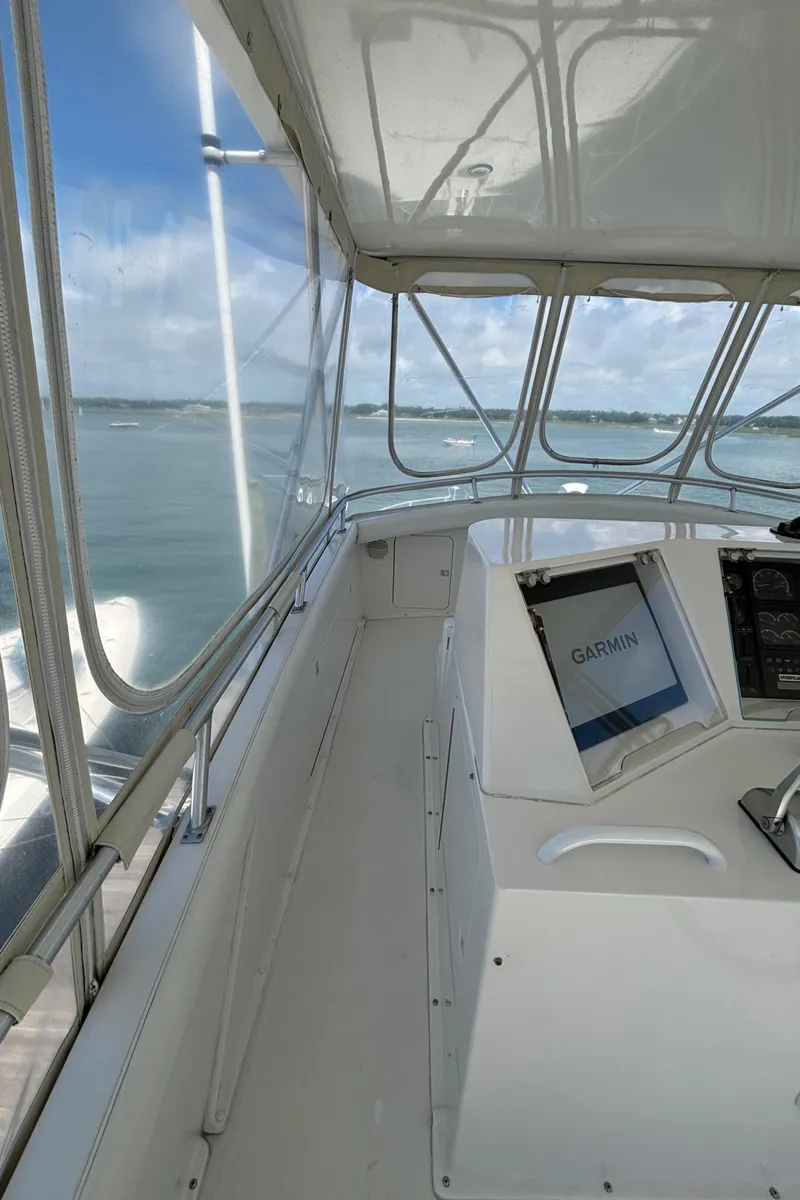 Slide: The Image of 1999 Bertram 60 Convertible yacht helm with Garmin navigation system. - 25
