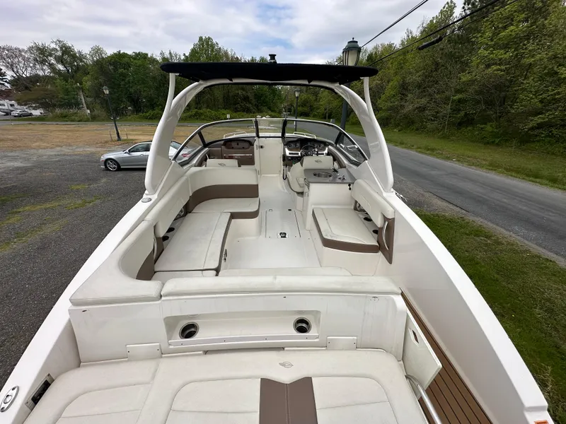 Slide: The Image of 2014 Chaparral 307 SSX boat with spacious seating and modern design. - 16