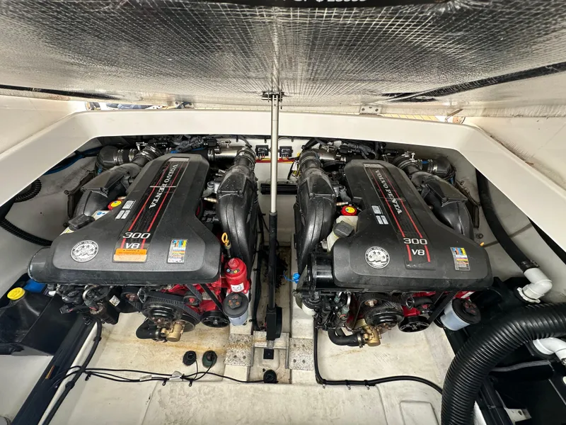 Slide: The Image of 2014 Chaparral 307 SSX boat engine compartment with twin Volvo Penta 300 V8 engines. - 2