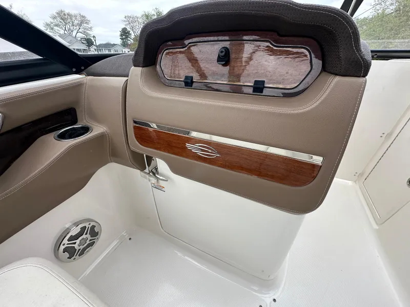Slide: The Image of Interior of a 2014 Chaparral 307 SSX boat with wood and leather accents. - 22