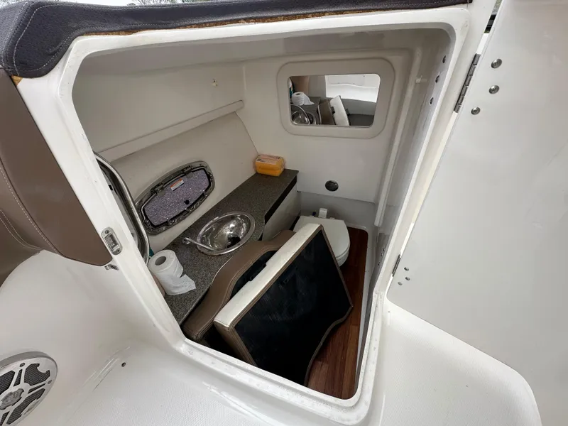 Slide: The Image of Interior cabin of a 2014 Chaparral 307 SSX boat with sink and toilet. - 24