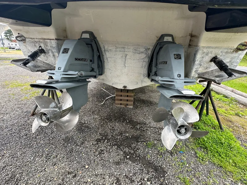 Slide: The Image of 2014 Chaparral 307 SSX dual propellers and outdrives on land. - 32