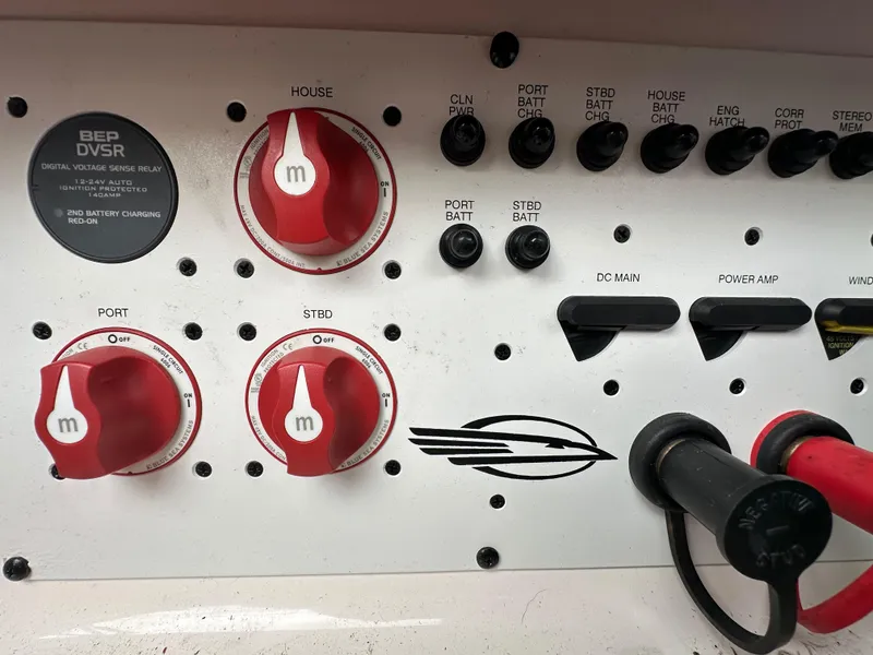 Slide: The Image of Control panel of a 2014 Chaparral 307 SSX boat with battery switches and voltage relay. - 35