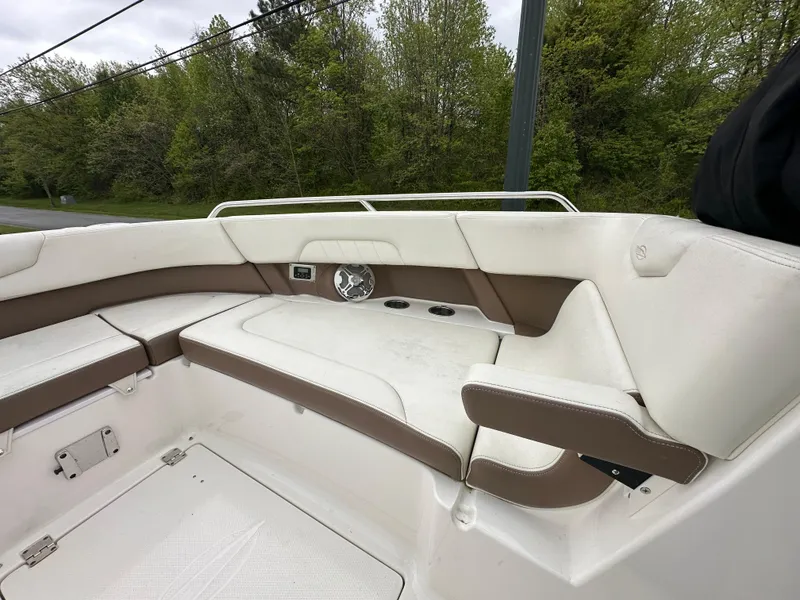 Slide: The Image of 2014 Chaparral 307 SSX boat interior with white and brown seating. - 45