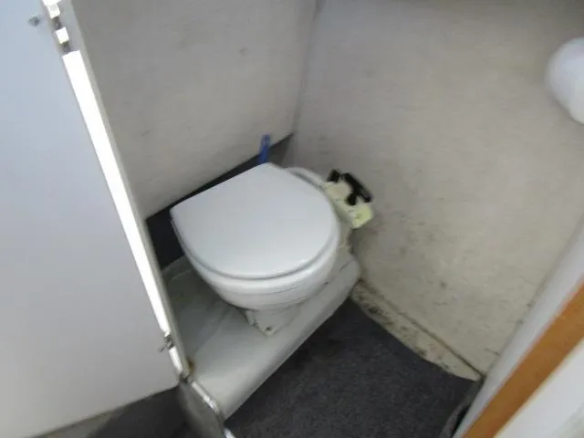 Slide: The Image of 1994 Bayliner 2452 Classic boat bathroom with toilet. - 15