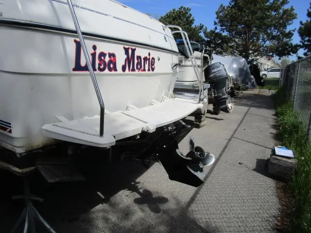 Slide: The Image of 1994 Bayliner 2452 Classic boat named Lisa Marie docked on a sunny day. - 4