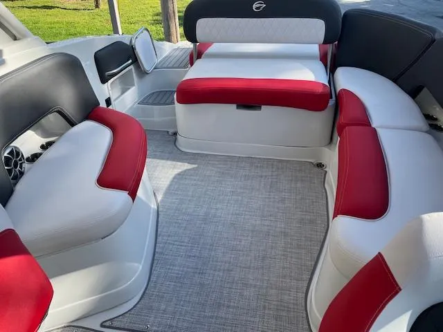 Slide: The Image of Interior of 2024 Crownline 290 SS boat with red and white seating. - 4