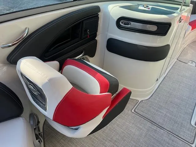 Slide: The Image of 2024 Crownline 290 SS boat interior with red and white seating. - 5