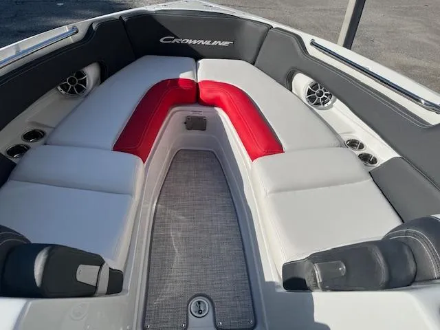 Slide: The Image of 2024 Crownline 290 SS boat interior with red and white seating. - 8
