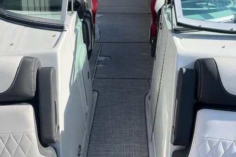 Slide: The Image of 2024 Crownline 290 SS boat interior with white and black seating. - 9