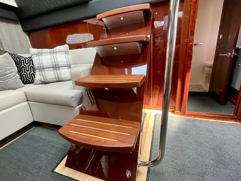 Slide: The Image of Interior stairs of a 2009 Sea Ray 470 Sundancer yacht with modern design. - 15