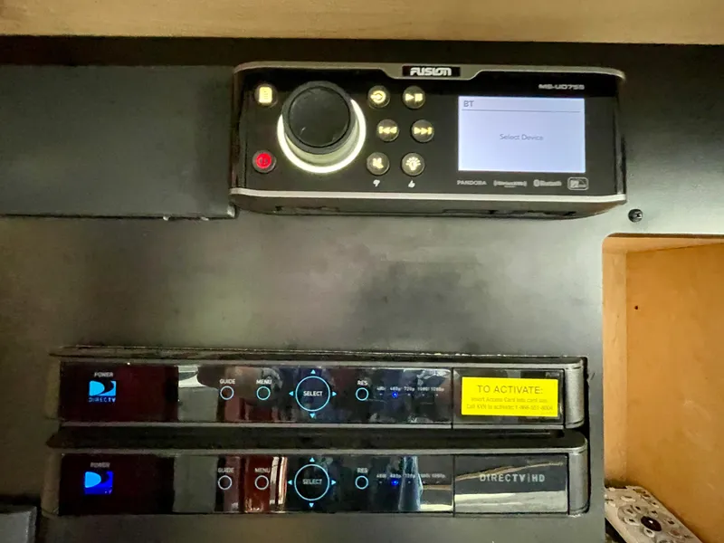 Slide: The Image of Fusion stereo system and DirecTV receivers in a 2009 Sea Ray 470 Sundancer yacht. - 25