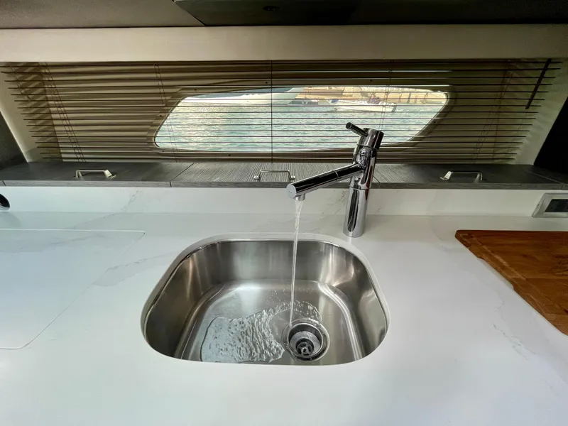 Slide: The Image of Modern kitchen sink on 2009 Sea Ray 470 Sundancer yacht with water flowing. - 32