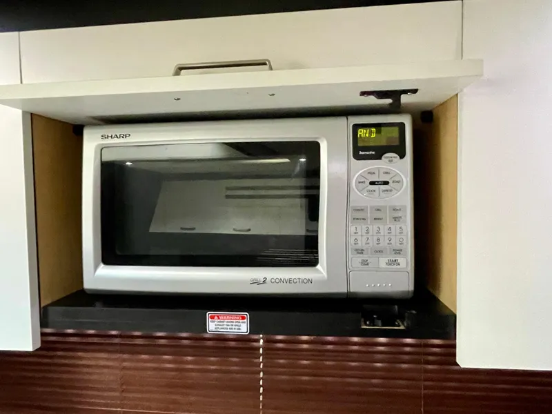 Slide: The Image of Built-in Sharp microwave in 2009 Sea Ray 470 Sundancer yacht kitchen. - 35