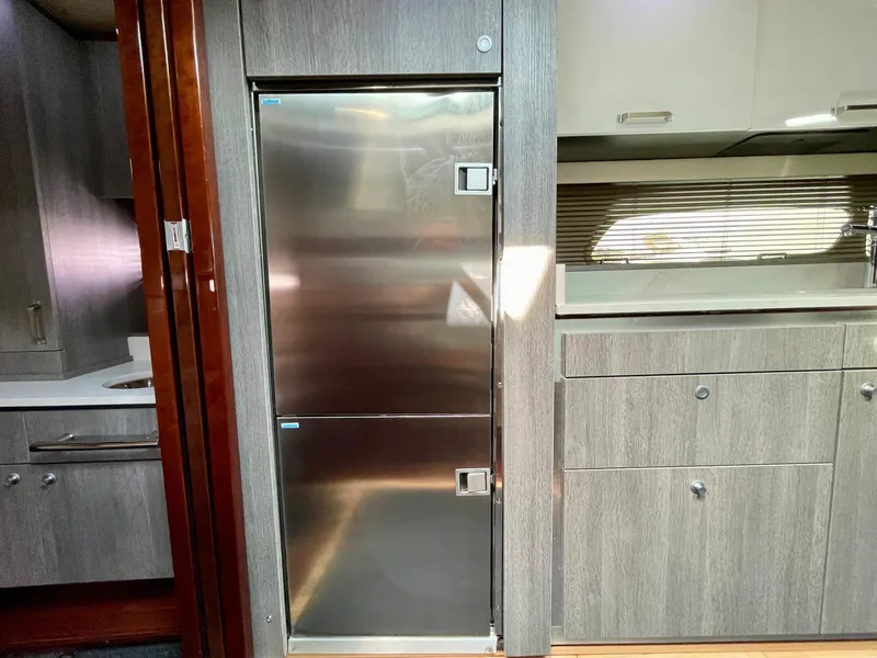 Slide: The Image of Modern kitchen area in a 2009 Sea Ray 470 Sundancer yacht with stainless steel appliances. - 36