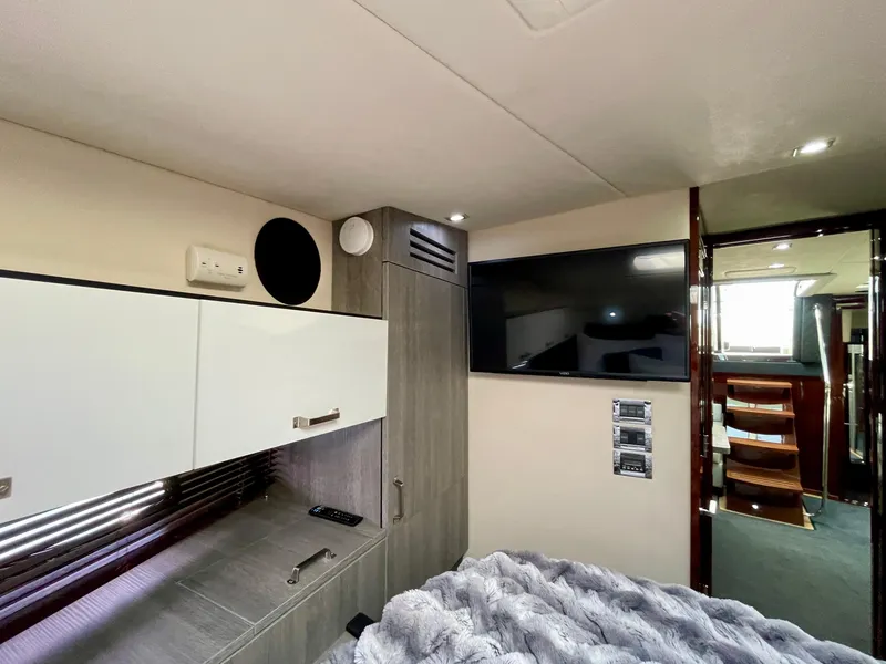 Slide: The Image of Interior cabin of 2009 Sea Ray 470 Sundancer with TV and storage cabinets. - 49