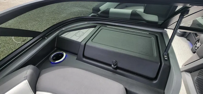 Slide: The Image of 2024 Avalon Windshield Catalina 2585 interior with storage compartment and cup holder. - 10