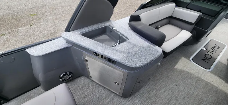 Slide: The Image of 2024 Avalon Windshield Catalina 2585 boat interior with sink and seating area. - 11