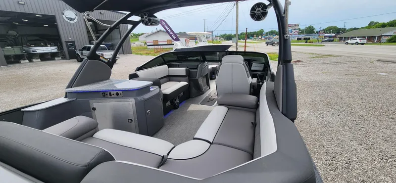 Slide: The Image of 2024 Avalon Windshield Catalina 2585 boat interior with modern seating and sound system. - 13